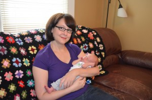 Jennifer Krause and baby Jack sitting at home - happy and healthy with the support of Porchlight VNA